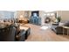 Comfortable living room with large sectional sofa, accent furniture, and carpeted floors at 1721 Wingfeather Ln, Castle Rock, CO 80108