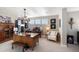 Spacious home office offers ample workspace, natural light, and stylish furnishings for productivity at 1721 Wingfeather Ln, Castle Rock, CO 80108
