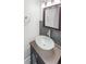 Updated bathroom with vessel sink and dark vanity at 1335 S Danube Way # 105, Aurora, CO 80017