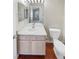 Clean bathroom with updated vanity, toilet, and mirror at 1335 S Danube Way # 105, Aurora, CO 80017