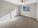 Bright bedroom with carpeted floor and ceiling fan at 1335 S Danube Way # 105, Aurora, CO 80017