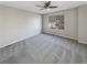 Comfortable bedroom with ceiling fan and carpet at 1335 S Danube Way # 105, Aurora, CO 80017