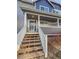 Inviting exterior with stairs leading to a charming front porch at 1335 S Danube Way # 105, Aurora, CO 80017