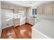 Efficient kitchen with light wood cabinets and appliances at 1335 S Danube Way # 105, Aurora, CO 80017