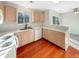 Modern kitchen featuring light wood cabinets and flooring at 1335 S Danube Way # 105, Aurora, CO 80017
