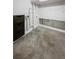 Unfinished laundry room with concrete floor at 1335 S Danube Way # 105, Aurora, CO 80017