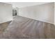 Large living room with neutral carpet and sliding glass door to balcony at 1335 S Danube Way # 105, Aurora, CO 80017