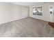 Bright living room featuring neutral walls and carpet at 1335 S Danube Way # 105, Aurora, CO 80017
