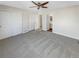 Spacious main bedroom with neutral carpeting and ample closet space at 1335 S Danube Way # 105, Aurora, CO 80017