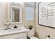 Tastefully decorated half-bathroom with modern fixtures and neutral tones at 4588 S Versailles St # B, Aurora, CO 80015