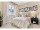 Inviting bedroom with cozy decor, neutral tones, and modern furnishings at 4588 S Versailles St # B, Aurora, CO 80015