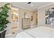 Well-appointed bedroom featuring a view of the ensuite bathroom and closet at 4588 S Versailles St # B, Aurora, CO 80015