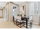Dining area featuring dark wood table and modern upholstered chairs near windows at 4588 S Versailles St # B, Aurora, CO 80015