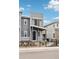 Modern townhouse with neutral color scheme and minimalist landscaping at 4588 S Versailles St # B, Aurora, CO 80015