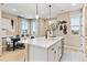 Bright kitchen island featuring quartz countertop with dining area at 4588 S Versailles St # B, Aurora, CO 80015