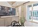 Cozy living room with modern console and large sliding glass doors to an outdoor area at 4588 S Versailles St # B, Aurora, CO 80015