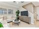 Bright living room featuring neutral tones, modern furniture, and lots of sunlight at 4588 S Versailles St # B, Aurora, CO 80015