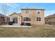 Relax in this home's private backyard, featuring a patio, fire pit, grill, and outdoor furniture set at 1017 Mircos St, Erie, CO 80516