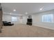 Finished basement with entertainment space with a TV and window for natural light at 1017 Mircos St, Erie, CO 80516