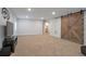 Finished basement offering carpet, modern lighting, entertainment, and interior access to the bathroom at 1017 Mircos St, Erie, CO 80516