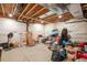 Unfinished basement with exposed ceiling and plenty of room for storage at 1017 Mircos St, Erie, CO 80516