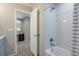 Bathroom with tub and white tile surround at 1017 Mircos St, Erie, CO 80516