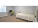 Cozy bedroom featuring neutral carpet, a desk setup, and a comfortable bed at 1017 Mircos St, Erie, CO 80516
