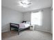 Bedroom with neutral walls, plush carpet, ceiling fan, and lots of light from a window at 1017 Mircos St, Erie, CO 80516