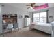 Bedroom with decor, including a desk, dresser, ceiling fan, and natural light at 1017 Mircos St, Erie, CO 80516