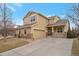 Beautiful two-story home featuring a covered front porch and an attached two-car garage at 1017 Mircos St, Erie, CO 80516