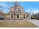 Attractive two-story home showcasing a welcoming front porch and a well-manicured front yard at 1017 Mircos St, Erie, CO 80516