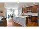 Stylish kitchen featuring stainless steel appliances, quartz countertops, and ample cabinet space at 1017 Mircos St, Erie, CO 80516