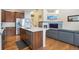 Modern kitchen features stainless steel appliances, quartz countertops, and a functional island at 1017 Mircos St, Erie, CO 80516