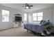 Cozy main bedroom with a ceiling fan, television, and mountain decor above the TV console at 1017 Mircos St, Erie, CO 80516