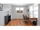 Spacious office with wood floors, natural light, desk, and stylish decor at 1017 Mircos St, Erie, CO 80516