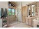 Luxurious bathroom showcasing a glass enclosed shower and vanity with vessel sink at 8699 Blue Creek Rd, Evergreen, CO 80439