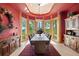 Elegant dining room with mountain views and custom woodwork at 8699 Blue Creek Rd, Evergreen, CO 80439