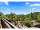 Breathtaking mountain view from stone overlook with iron railing at 8699 Blue Creek Rd, Evergreen, CO 80439