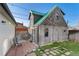 Backyard area featuring a patio with stone pavers and a shed with a green metal roof at 2815 Curtis St, Denver, CO 80205