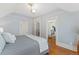 Bedroom with hardwood flooring, closet, and ensuite bathroom at 2815 Curtis St, Denver, CO 80205