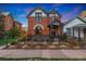 Charming brick home with a well-maintained front yard and inviting front porch at 2815 Curtis St, Denver, CO 80205