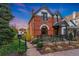 Beautiful brick home with manicured lawn and garden, offering curb appeal at 2815 Curtis St, Denver, CO 80205