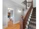 Spacious foyer with hardwood floors, staircase, and view into the living room at 2815 Curtis St, Denver, CO 80205