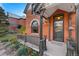 Inviting front porch with brickwork, detailed trim, and updated door at 2815 Curtis St, Denver, CO 80205