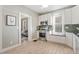 Well-lit kitchen with stainless steel oven, stone countertops, and wood flooring at 2815 Curtis St, Denver, CO 80205