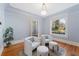 Bright living room featuring hardwood floors, large window, and neutral tones at 2815 Curtis St, Denver, CO 80205