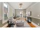 Comfortable living room showcasing natural light, stylish furniture, and hardwood floors at 2815 Curtis St, Denver, CO 80205
