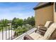 Relaxing balcony with outdoor seating and a beautiful green view for enjoying the scenery at 81 Falcon Hills Dr, Highlands Ranch, CO 80126
