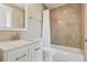 Cozy bathroom featuring a white vanity, and a tiled shower over the bathtub at 81 Falcon Hills Dr, Highlands Ranch, CO 80126
