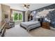Comfortable bedroom featuring a world map mural wall and natural lighting at 81 Falcon Hills Dr, Highlands Ranch, CO 80126